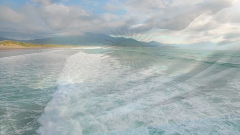 digital composition of argentina flag waving against aerial view of waves in the sea