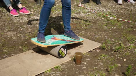 person balancing on a balance board