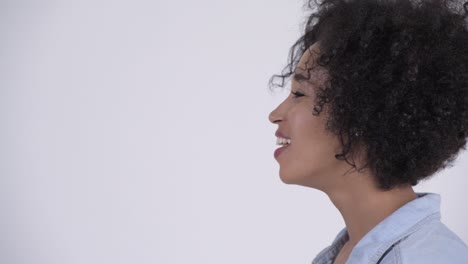 closeup profile view of happy young beautiful african woman