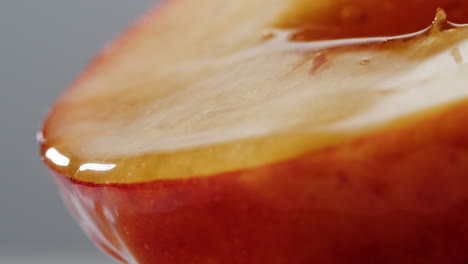 close-up of a honey-drizzled apple slice