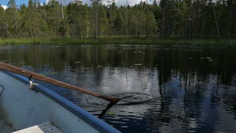 peaceful rowing boat on beautiful lake, calm water boat paddle rowing