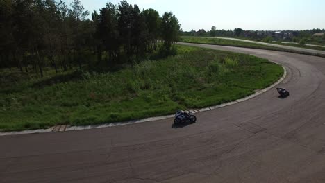 sport motorcycles riding on race track. aerial view group motorcycle