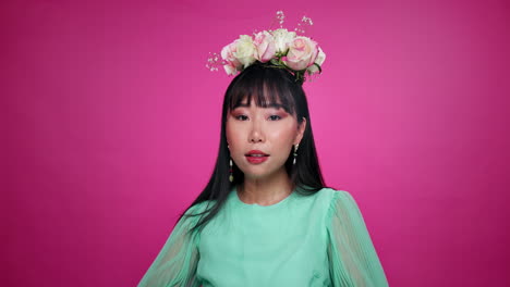 woman with flower crown and green dress