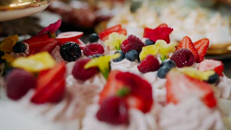 Fruit-cream-desserts-with-strawberries-and-raspberries,-close-up