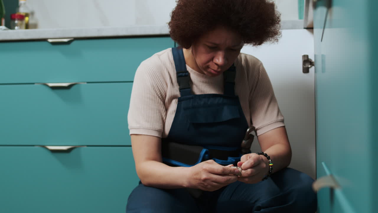 Plumber fixing water pipes