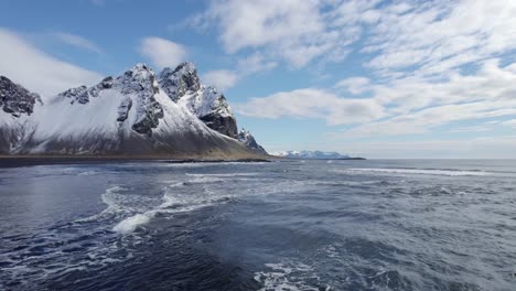 Drone-flying-over-sea-on-the-coast-of-Iceland-on-Stokksnes-headland