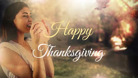 animation of happy thanksgiving text over leaves and caucasian woman