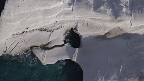 Drone-shot-at-the-beautiful-cliffs-of-Sarakiniko-in-Milos