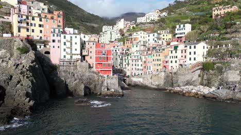 riomaggiore cinque terre italy aerial colourful and unique buildings of the village pullback reveal