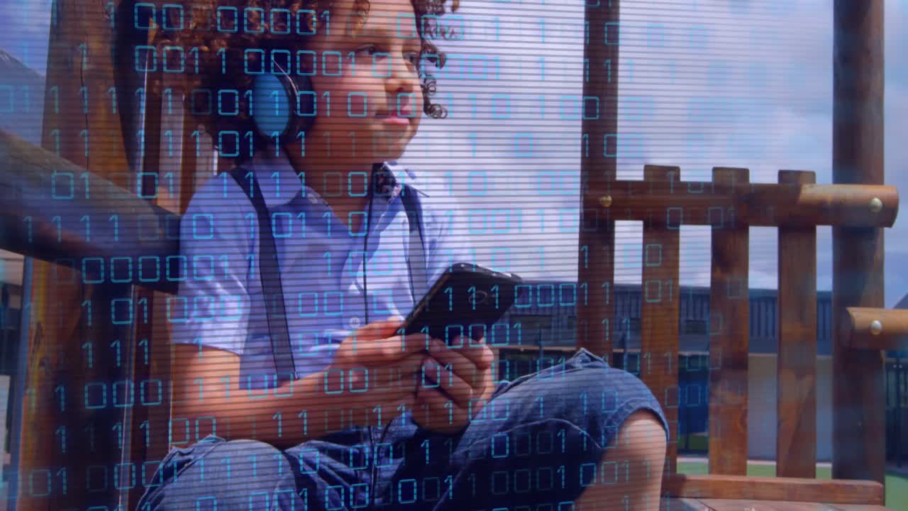 Animation of data processing over biracial boy using smartphone