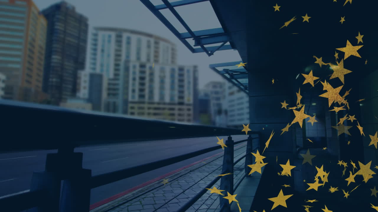 Golden stars animation over urban cityscape with modern buildings and road