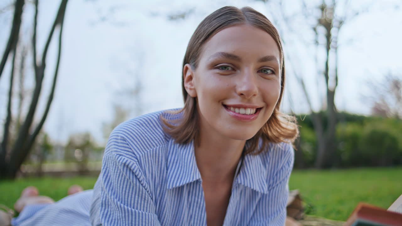 Romantic lady smiling nature park holding book closeup. Carefree woman picnic