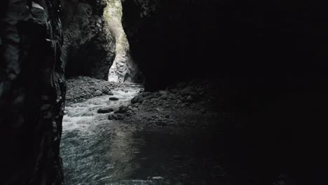 dark caved river curved by the water