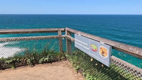 static view of a coastal informational sign and ocean