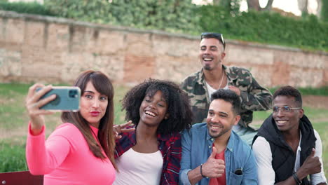 diverse group of friends taking a selfie outdoors
