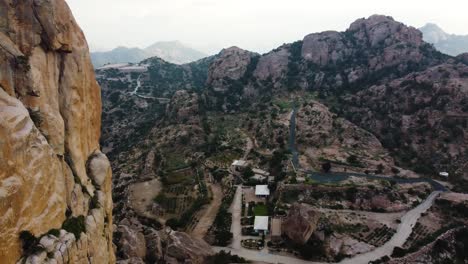 Aerial-drone-captures-small-village-in-Alshafa-Valley,-Taif,-Saudi-Arabia