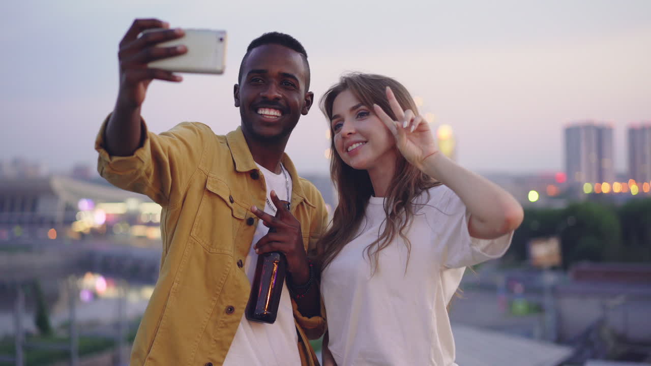 Friends taking a selfie at night in the city