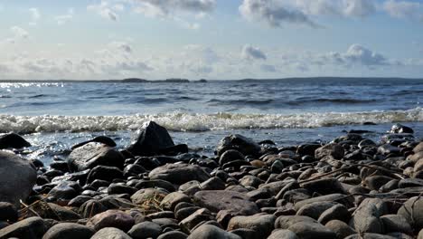 beautiful nature footage of a calm seashore. waves crashing against a rocky shoreline