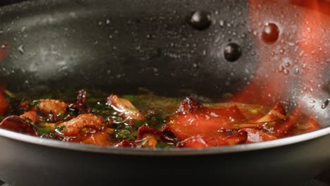 flaming food in a pan