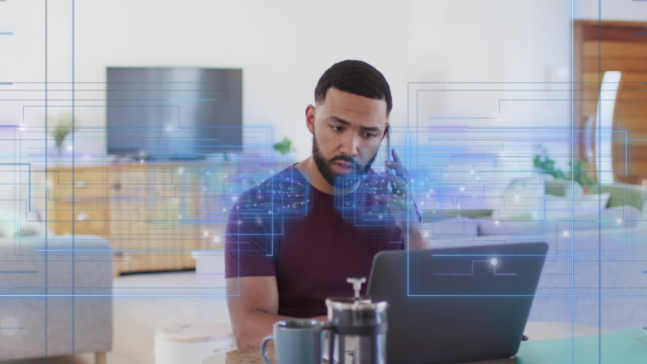 animación de luz y datos sobre un hombre biracial usando teléfono inteligente y computadora portátil