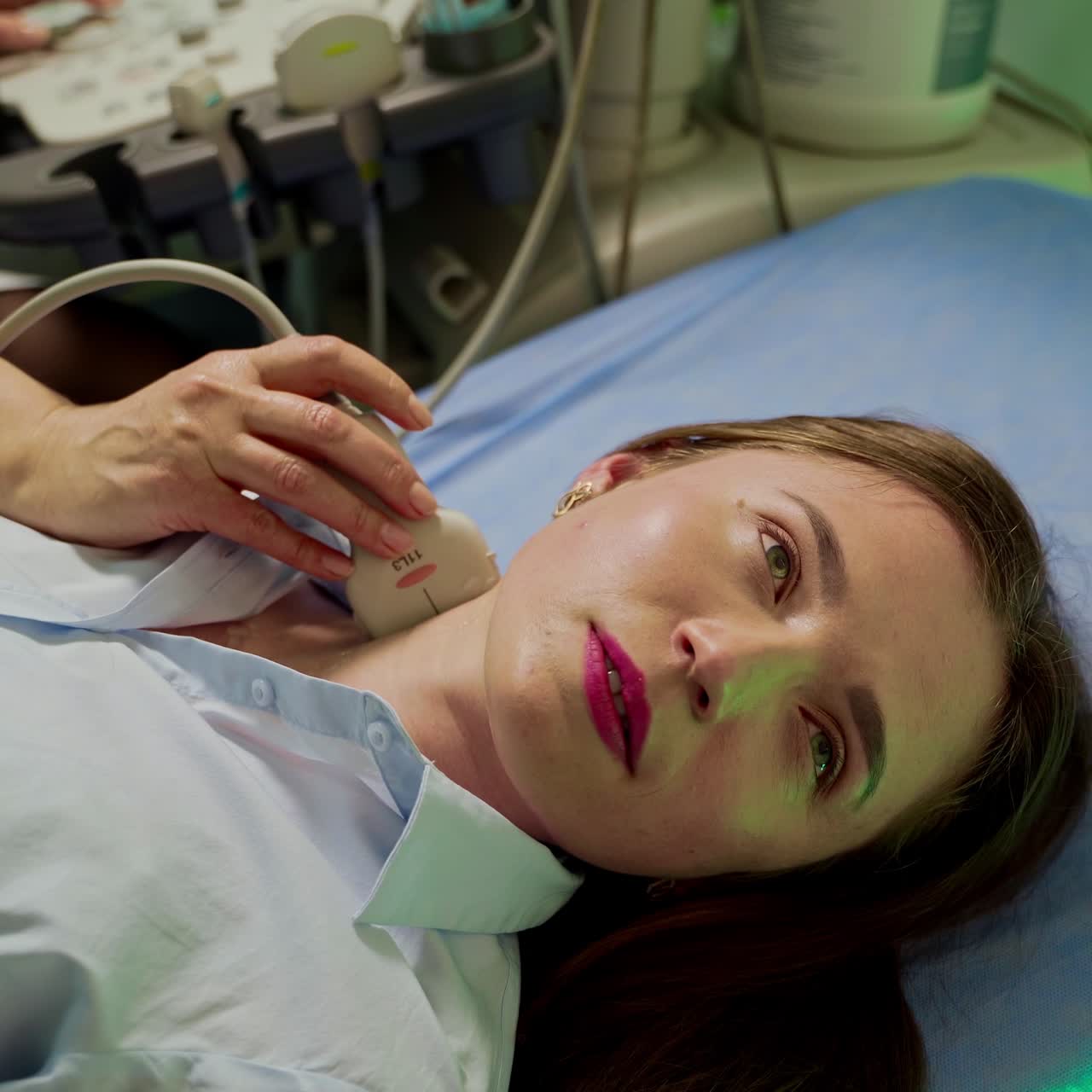 Uzi diagnostic on female patient. Woman checks her health status in modern clinic. Professional doctor is making ultrasound examination to a young woman in hospital.