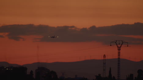 Airplane-in-flight-at-sunset