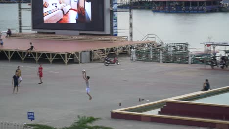 men playing soccer in street 5