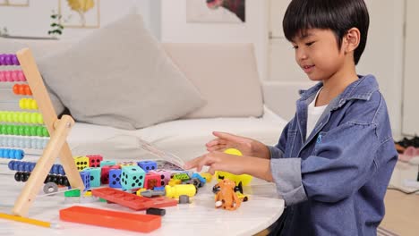 a boy in a cozy room plays with colorful toys, displaying concentration and joy. bright lighting enhances the playful atmosphere