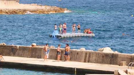 people enjoying water activities on a sunny day