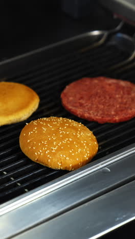 cooking beef and pork patty for burger. meat roasted at kitchen. slow motion. vertical video