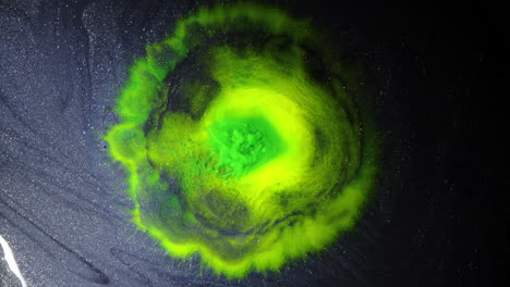 vibrant macro shot of green ink swirling on a dark surface, creating a mesmerizing effect