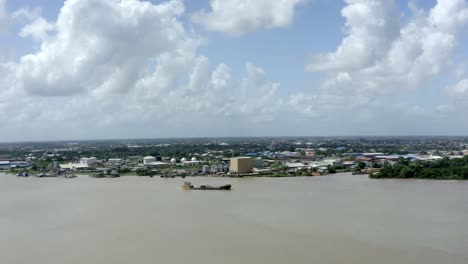 wide orbiting aerial viewpoint of a oil tanker boat captured with drone mavic 2 pro