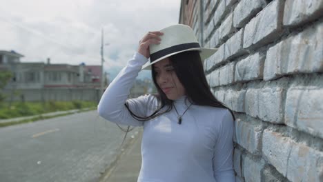 Attractive-young-hispanic-woman-wearing-white-long-sleeve-shirt