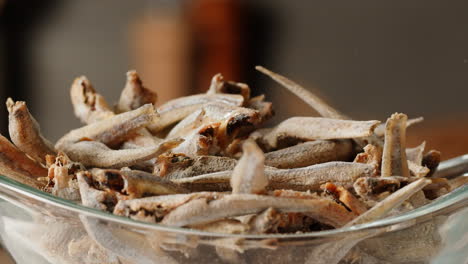 dried fish in a glass bowl