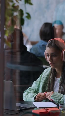 woman studying in a cafe