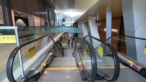 people using escalator at melbourne museum