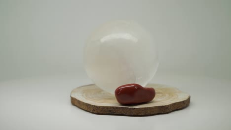 white round crystal ball and small red stone at the top of the turntable - close up shot