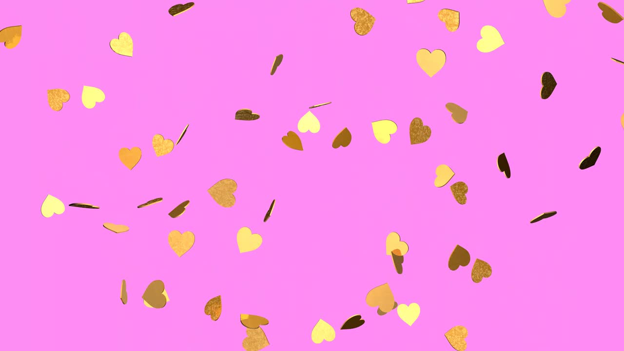 핑크색 배경에 떨어지는 금색 심장.