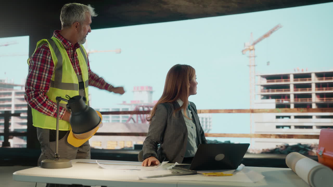 Construction Professionals Collaborating on a Building Project Site