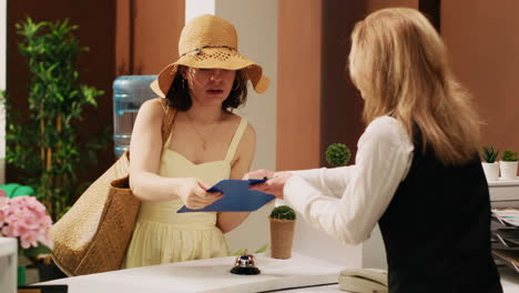 woman traveller signing forms