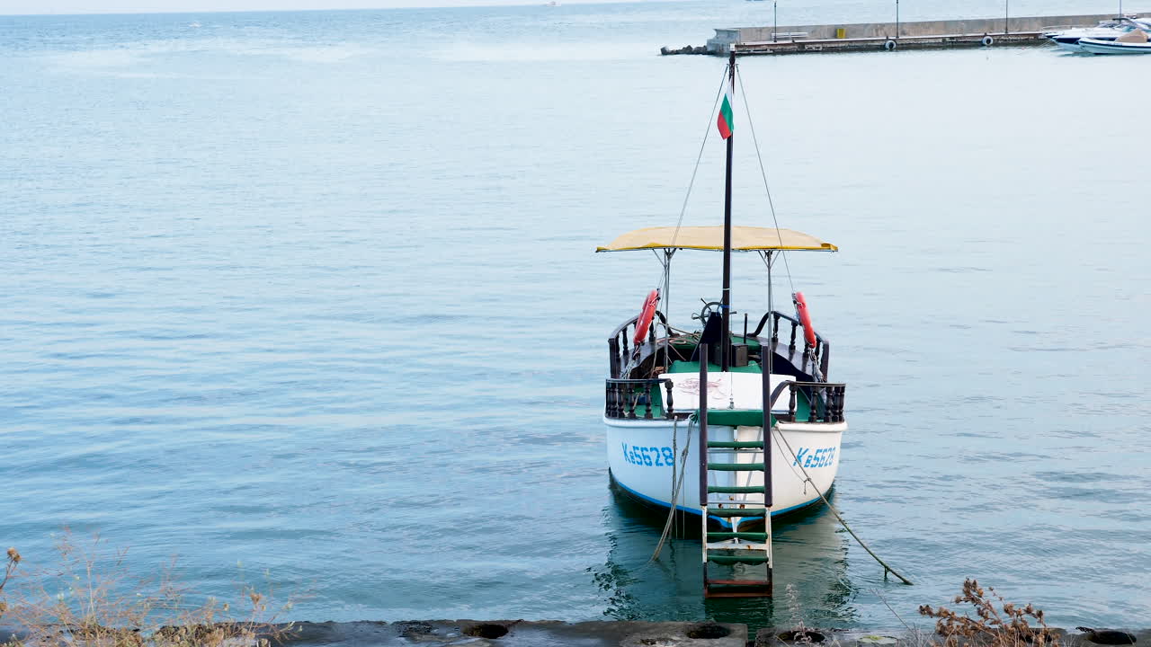 Front view of small boat in the harbour