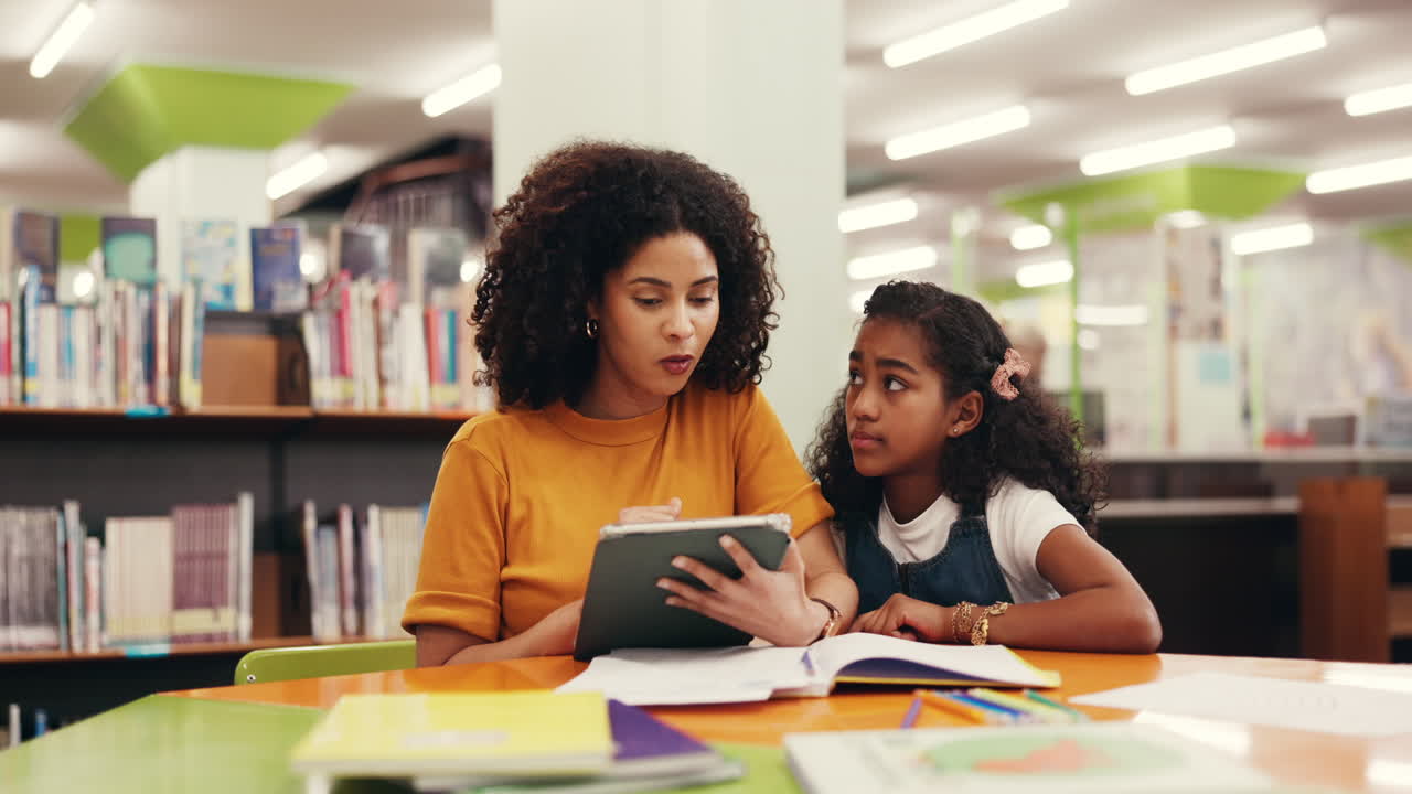 Teacher and student reading in the library