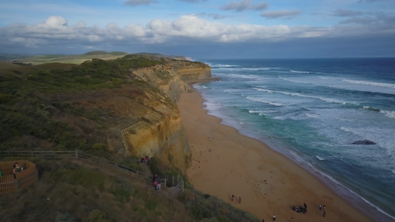 Forward smoothly Australia Twelve Apostles Drone Great Ocean Road Melbourne cinematic pan ocean scape with beautiful stunning sunset by Taylor Brant Film