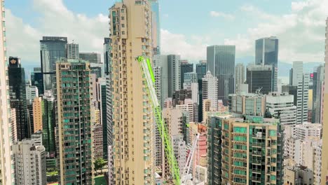 construction crane amongst skyscrapers in hong kong