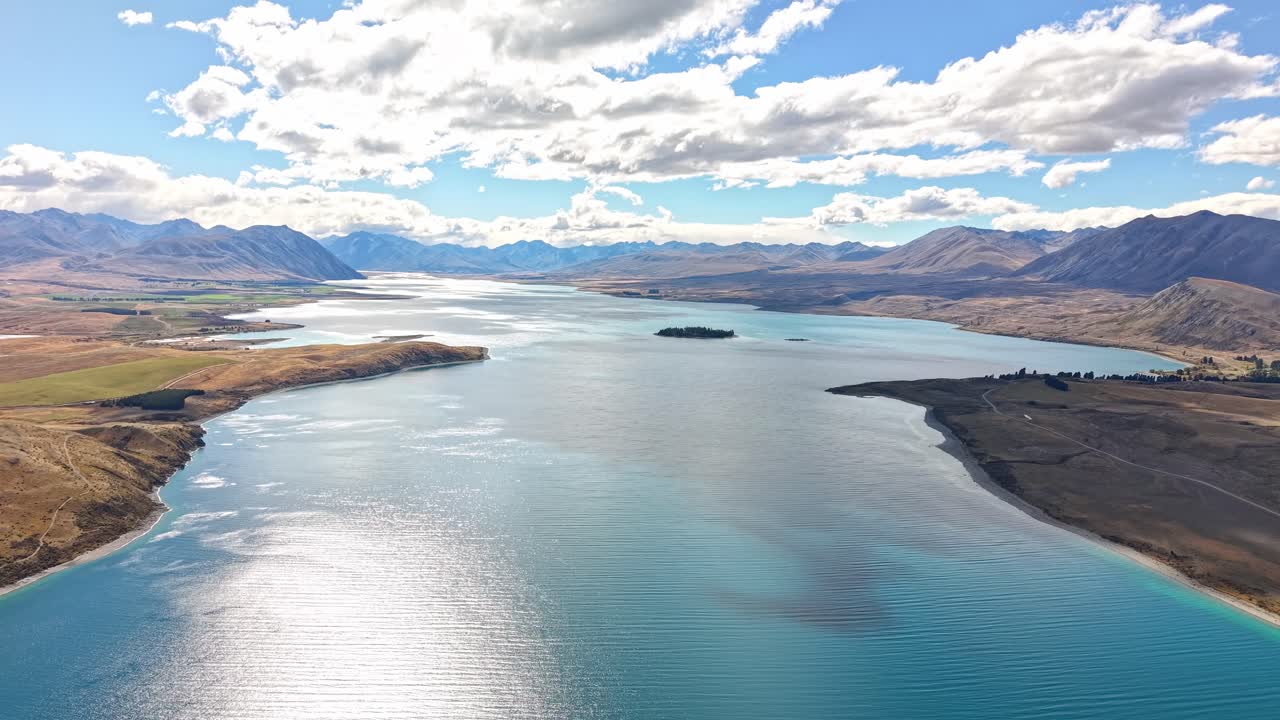 Breathtaking view of Tekapo Lake with vibrant skies and alpine scenery