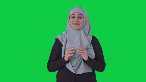 Happy-Muslim-woman-talking-to-the-camera-Green-screen