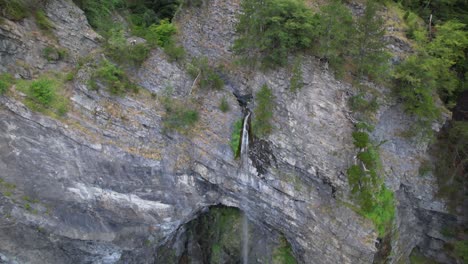 Waterfall-on-Alps-of-Albania-in-summer,-reduced-water-falling-from-mountains