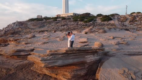 Loving-bride-and-groom-on-seashore-at-sunset