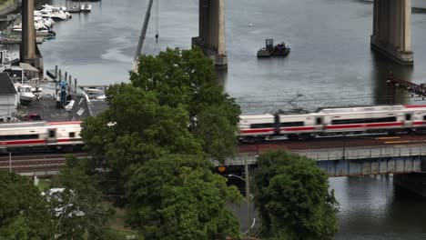 an aerial view of the saugatuck river railroad bridge in connecticut on a cloudy day