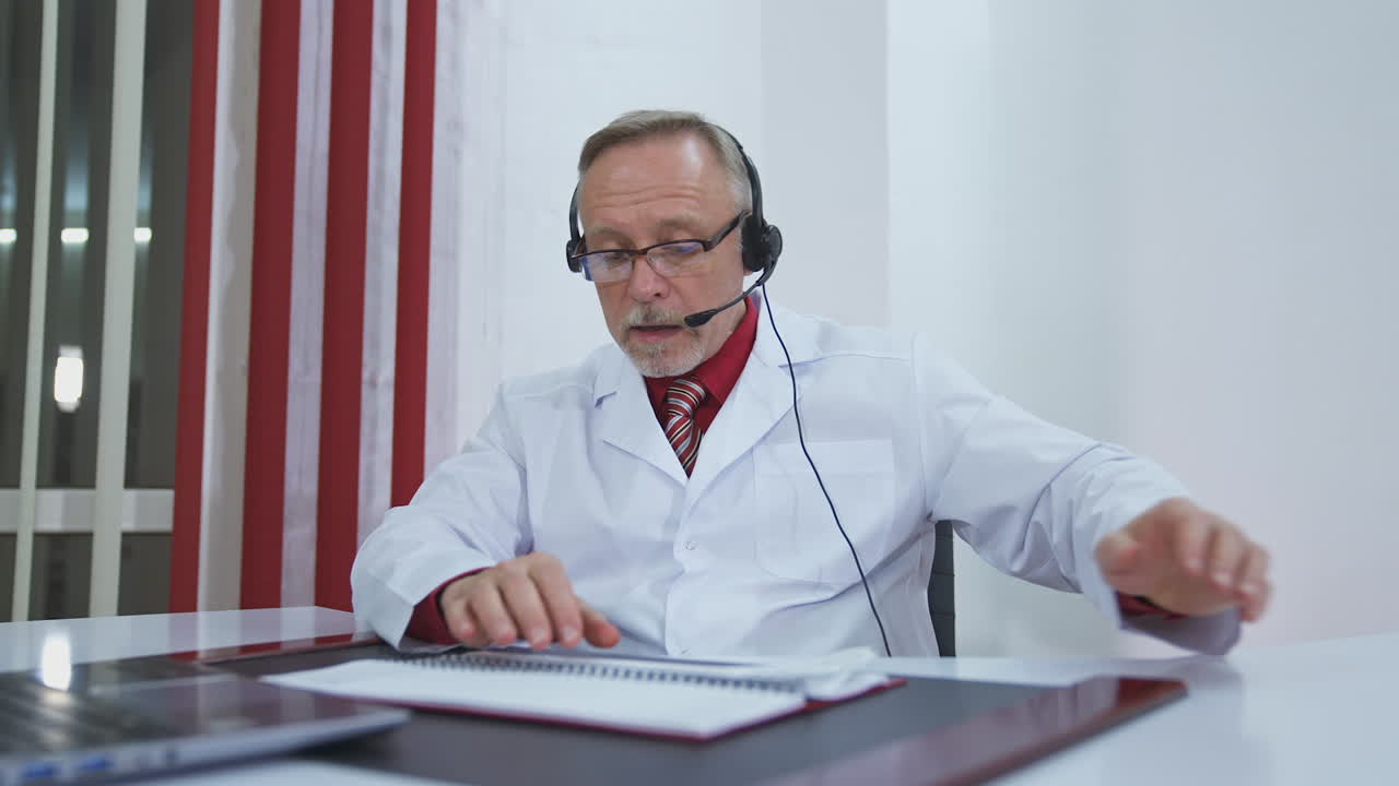 Telemedicine concept. Male doctor listening to patient talking symptom on the internet and make a discussion